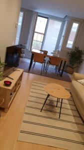 a living room with a table and a couch at El Solarón in Gijón