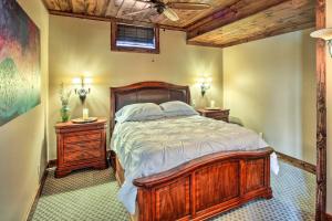 a bedroom with a wooden bed and two night stands at Countryside Vacation Rental Retreat in Paola