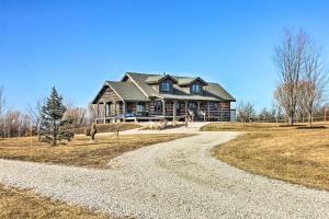 a large house sitting on top of a field at Countryside Vacation Rental Retreat in Paola