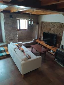 Posezení v ubytování Casa de piedra acogedora a 2 minutos de la playa