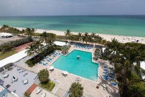 an aerial view of a pool and the beach at Sherry Frontenac Oceanfront in Miami Beach