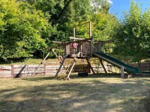 a playground with a slide in a park at Stable Cottage Peaceful Stunning Retreat near Bath in Upavon