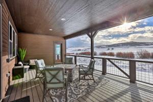 a balcony with a table and chairs and a view at Mountain-View Granby Retreat on Golf Course! in Granby