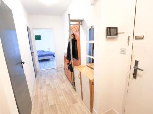 a hallway with a door leading to a bedroom at Apartment Hroncová, near city centre and park, quiet location in Košice
