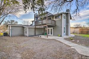 a house with a balcony on top of it at San Antonio Home with Deck, 6 Mi to Downtown! in San Antonio