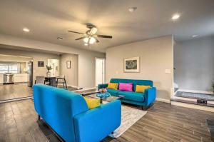 a living room with two blue couches and a table at San Antonio Home with Deck, 6 Mi to Downtown! in San Antonio