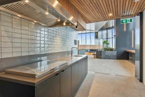 a kitchen with a sink and a counter top at CBD RiverView 2Bed Apt Kingbed at Tallest building in Brisbane