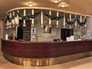 a bar in a restaurant with christmas decorations at Hotel Budapest in Budapest