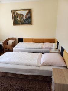 two beds sitting in a room with at U Bola in Debrzno