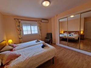 Postel nebo postele na pokoji v ubytování Velez Nazari Centro 2