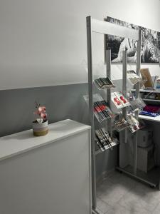 a room with a shelf with cosmetics on it at Sobe “Stari Grad-Samobor” in Samobor