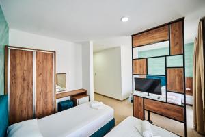Hotel Halibas客房内的一张或多张床位