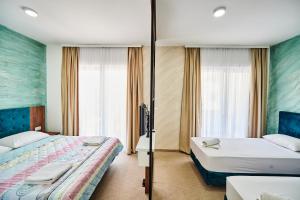 Hotel Halibas客房内的一张或多张床位