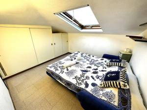 a bedroom with a large bed in a room at Suite a 1 minuto dalla spiaggia a piedi - Sanremo in Sanremo