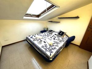 a bedroom with a large bed in a room with a window at Suite a 1 minuto dalla spiaggia a piedi - Sanremo in Sanremo