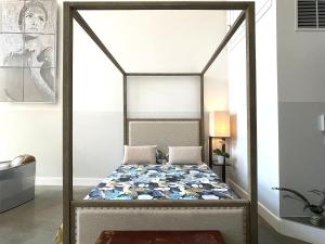 a bed in a room with a canopy bed at Duplex Suite in Art Tower in Philadelphia