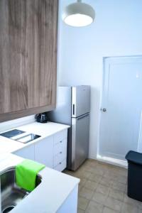 A kitchen or kitchenette at Digital Nomad San Agustin Apartments