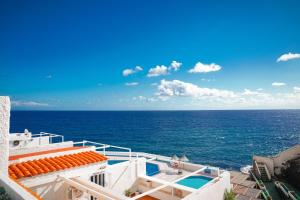 a view of the ocean from the top of a building at Marina Blue, Las Caletillas in Candelaria