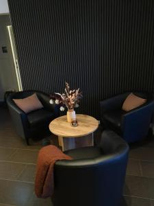 Posezení v ubytování Gamla Järnhandeln - Norrskedika Hotell