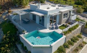 an aerial view of a house with a swimming pool at Sene Villa - Sea Front in Plakias