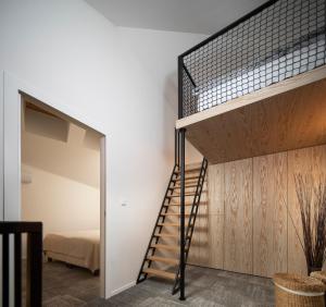 a staircase in a room with a bedroom at Bird's eye view, Hillside in Dolný Kubín