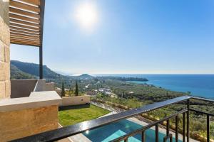 a villa with a view of the ocean at Mani Theasis in Stoupa