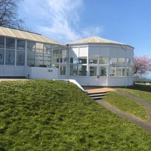 a large white building with a lawn in front of it at Parkdean Resorts Bideford Bay Bucklands 21 in Bideford