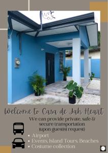 a blue house with a sign that says welcome to cayuga de bat island at The Blue Moroccan Door - A modern 3 bedroom,2 bathroom home 