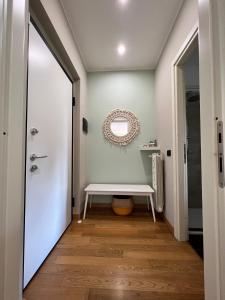 a hallway with a bench and a mirror at Il Canneto in Lomnago +36 photos