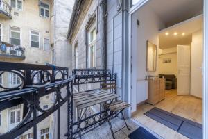 a balcony with a bench on the side of a building at Anastasia 2 bedrooms apartment on Váci utca in Budapest