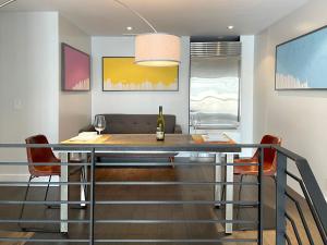 a dining room with a table and two chairs at Duplex Suite in Art Tower in Philadelphia