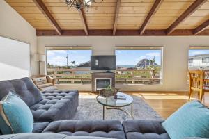 a living room with a couch and a fireplace at Hillcrest Haven in Morro Bay