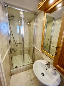 a bathroom with a shower and a sink and a shower at Dream Beachfront Bungalow in Limassol