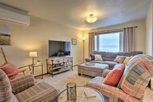 a living room with a couch and a tv at Rapid City Vacation Home with Wraparound Deck! in Rapid City