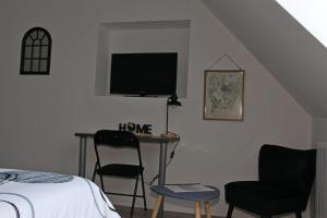 TV a/nebo společenská místnost v ubytování Location Tame