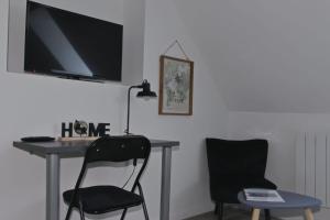 TV a/nebo společenská místnost v ubytování Location Tame