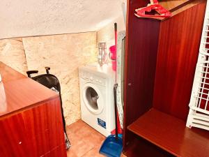 a small room with a washing machine in it at Attico a Roma in Rome
