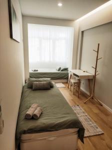 Tempat tidur dalam kamar di Elite House Estoril