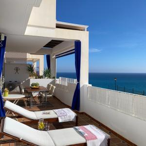 a balcony with a view of the ocean at RESIDENCIAL OASIS 2 in Mojácar