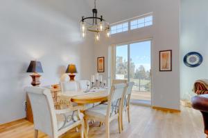 a dining room with a table and chairs at Cinnamon Teal Dream in Redmond