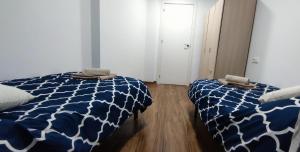 A bed or beds in a room at Acogedor Ático en Pleno Centro