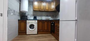 A kitchen or kitchenette at Acogedor Ático en Pleno Centro