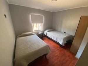 Katil atau katil-katil dalam bilik di Casa amoblada, Los Vilos