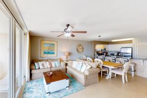 a living room with a couch and a table at The Terrace at Pelican Beach 504 in Destin
