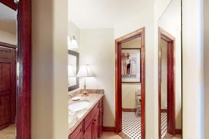 a bathroom with a sink and a mirror at Skyland Studio in Crested Butte