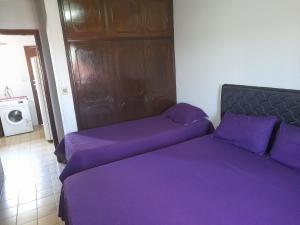 Ένα ή περισσότερα κρεβάτια σε δωμάτιο στο AparWil