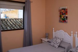 Postel nebo postele na pokoji v ubytování Sanvi Xerez Centro