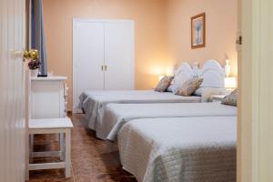 Postel nebo postele na pokoji v ubytování Sanvi Xerez Centro