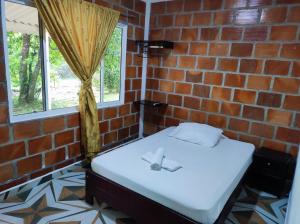Postel nebo postele na pokoji v ubytování Hotel Campo Verde