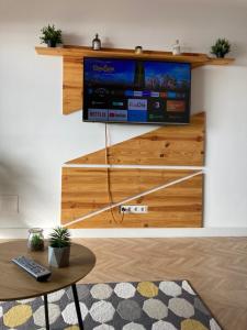 a living room with a tv on a wall at The view will convince you! in Puerto de Santiago